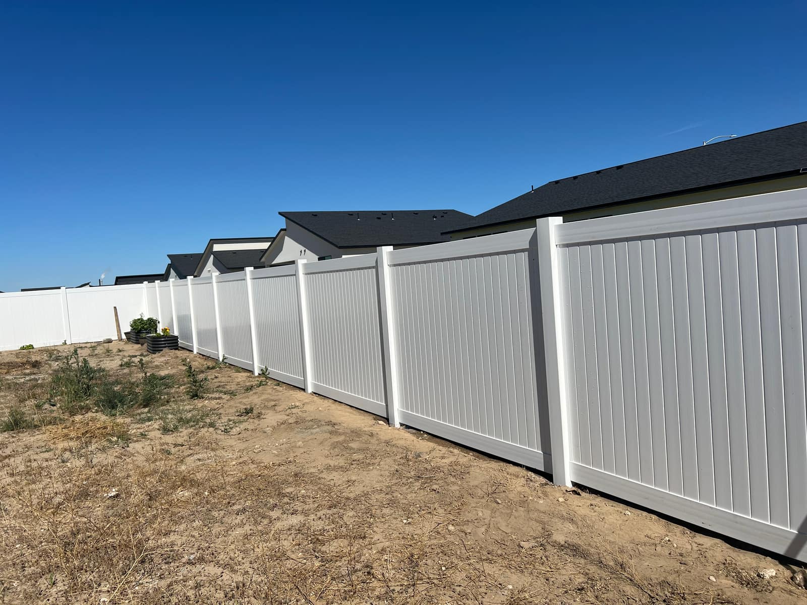 Finished vinyl fence run